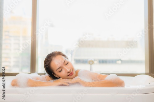 Portrait beautiful young asian woman relax enjoy take a bath in bathtub