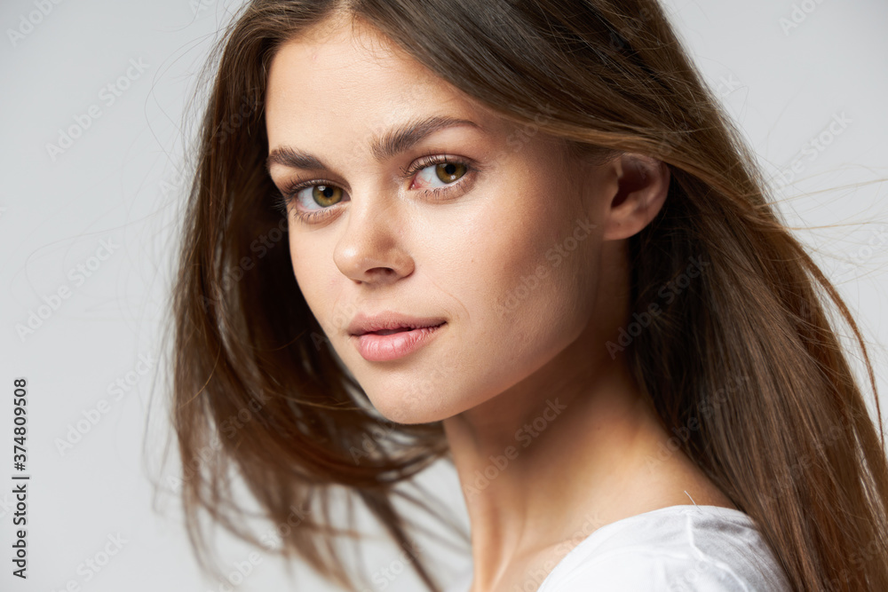 Naklejka premium Woman portrait attractive look long hair close-up 
