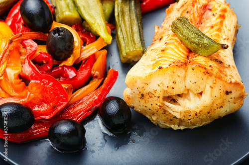 Baked fish with vegetables photo