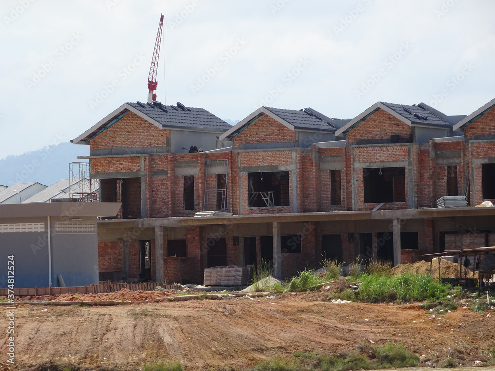 SEREMBAN, MALAYSIA -APRIL 07, 2020: New double story luxury terrace house under construction in Malaysia. Designed by an architect with a modern and contemporary style. SEREMBAN, MALAYSIA -APRIL 07, 2020: New double story luxury terrace house under construction in Malaysia. Designed by an architect with a modern and contemporary style.