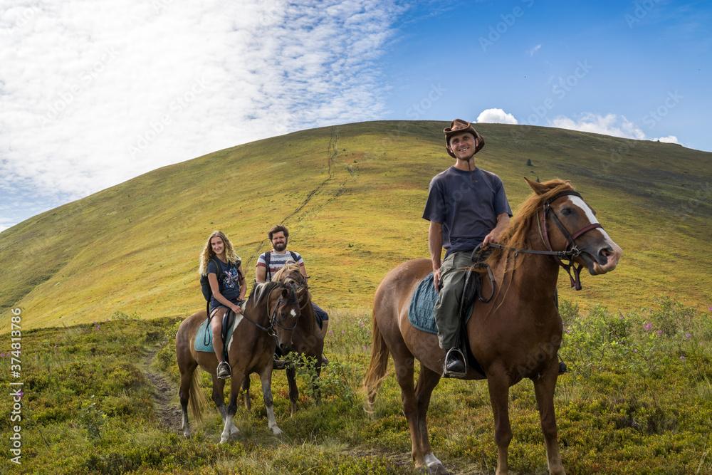 Horseback riding in the Carpathian mountains.