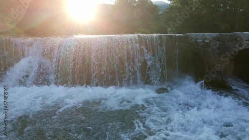 water flowing over the river