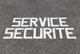 Security service written on asphalt called service securite in french language 