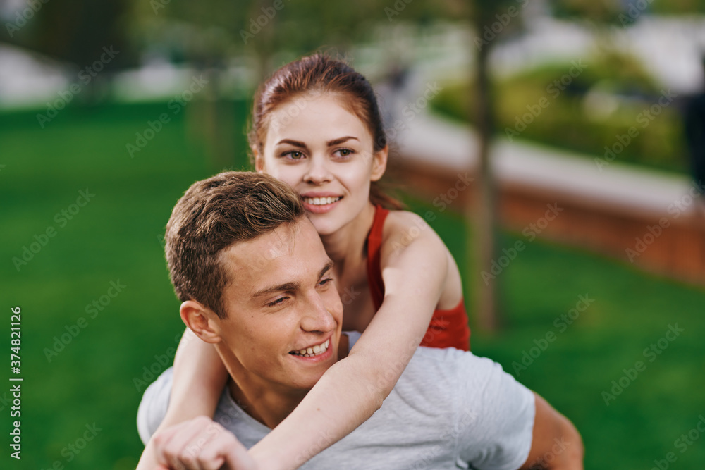 woman on back men outdoors walk fun lifestyle woman on back men outdoors walk fun lifestyle