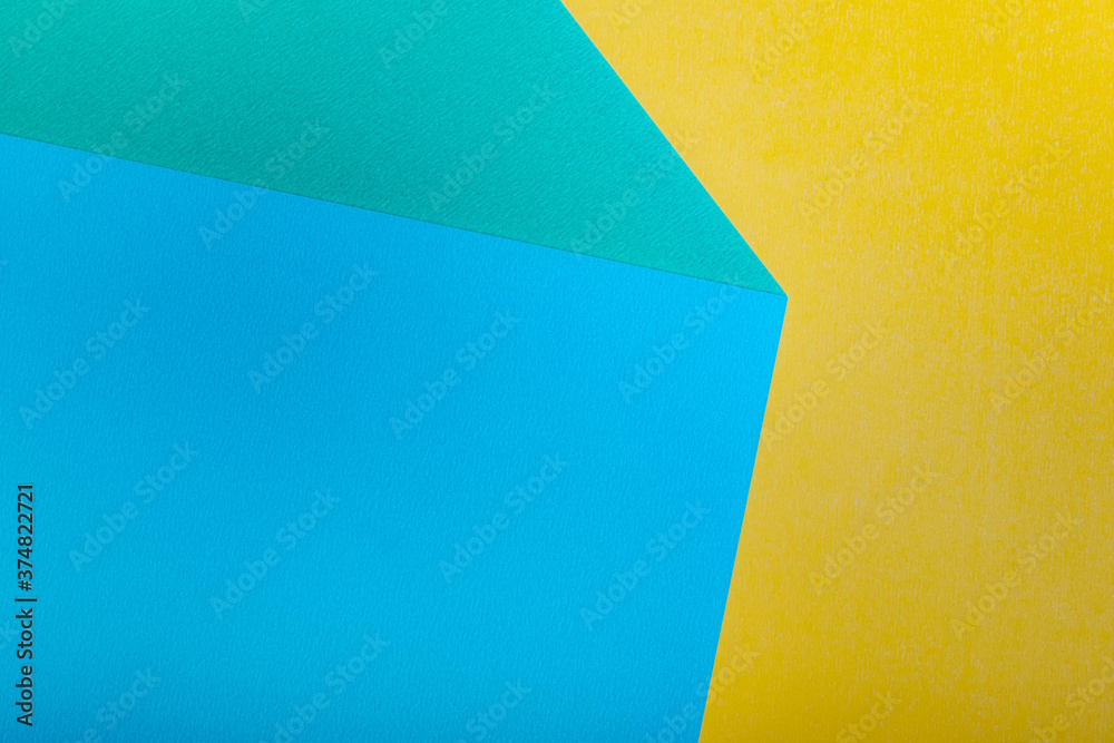 Paper color blue yellow green background. selective focus. copy space Paper color blue yellow green background. selective focus. copy space