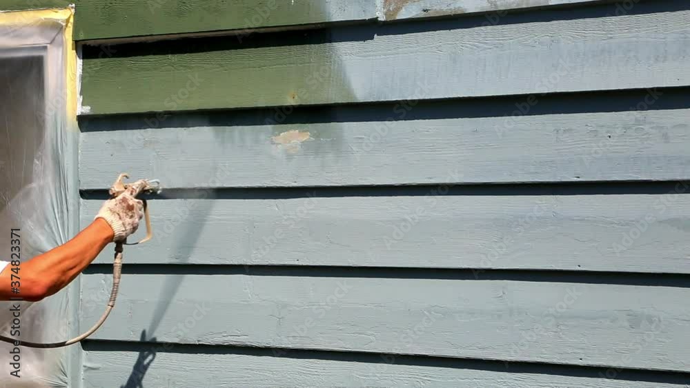 Spray painting house exterior wood siding