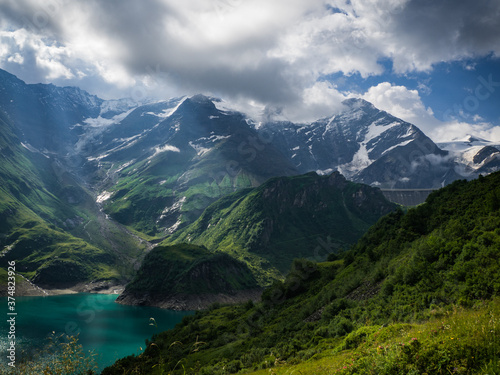 Scenic view on Wasserfallboden See near Kaprun, Austria, Europe. National park Hohe Tauern. Charming lake with amazing deep colorful water and wild clouds on sky.