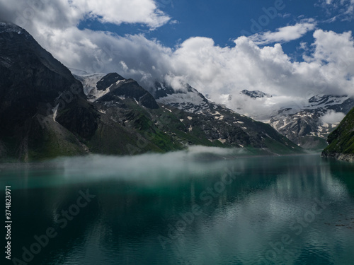 Scenic view on Mooserboden See near Kaprun  Austria  Europe. National park Hohe Tauern. Charming lake with amazing deep colorful water and glaciers above it. Favourite destination for holidays.