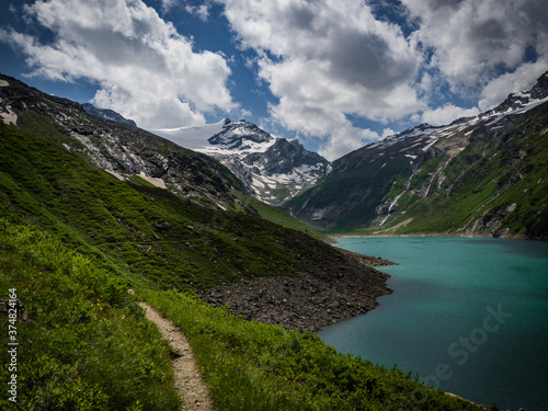 Fototapeta Naklejka Na Ścianę i Meble -  Scenic view on Mooserboden See near Kaprun, Austria, Europe. National park Hohe Tauern. Charming lake with amazing deep colorful water and glaciers above it. Favourite destination for holidays.