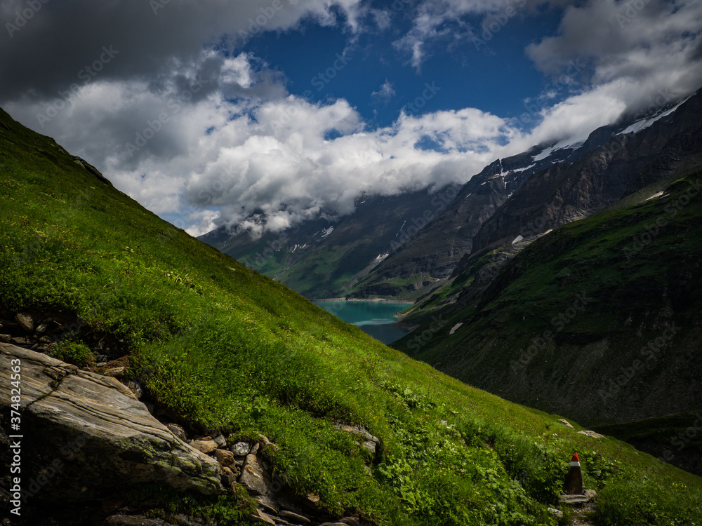 Scenic view on Mooserboden See near Kaprun, Austria, Europe. National park Hohe Tauern. Charming lake with amazing deep colorful water and glaciers above it. Favourite destination for holidays.