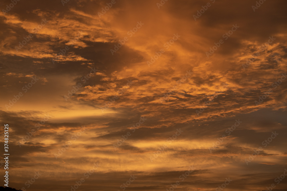 Orange clouds in the sky during the sunset