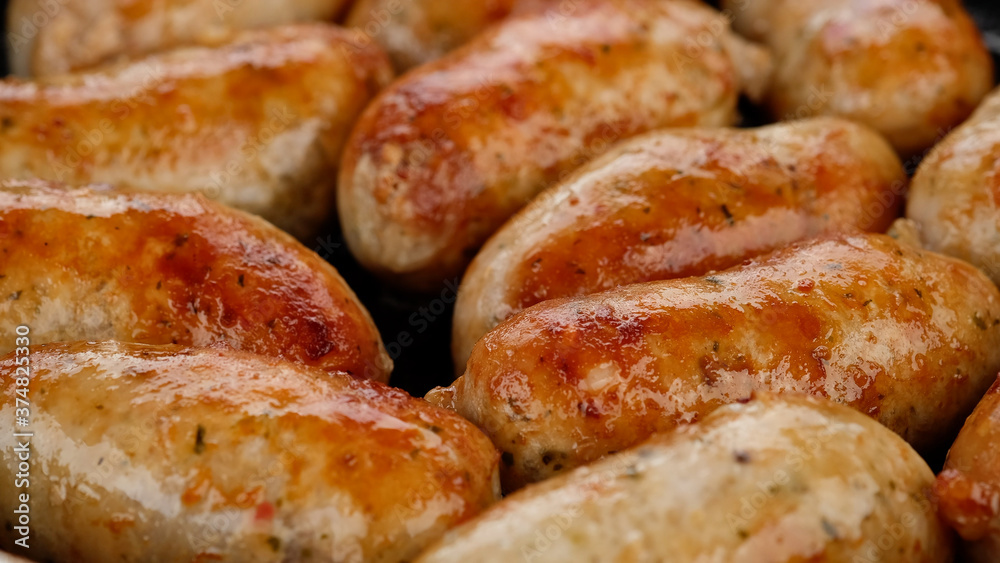 sausage fried on pan, close up