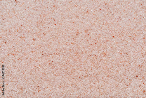 Himalayan pink salt granules macro shot background