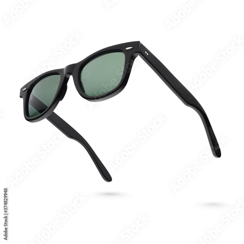 Black plastic sunglasses isolated on white. photo