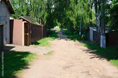 A quiet street in a small village on a summer morning. Moscow region. Russia.