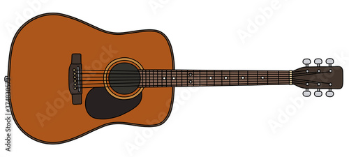 The vectorized hand drawing of a classic accoustic guitar