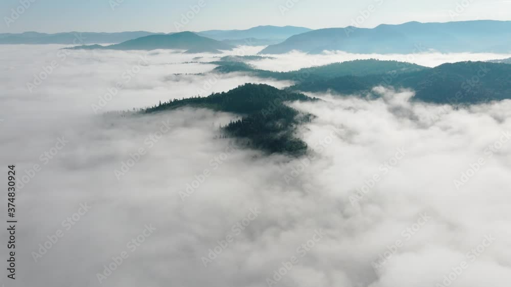 Flying through the clouds above mountain tops. High peaks wonderful morning sunrise natural Landscape Flying through the clouds above mountain tops. High peaks wonderful morning sunrise natural Landscape