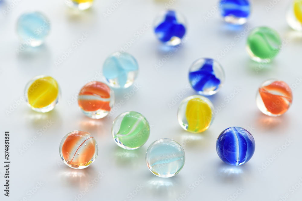 Fototapeta premium Colorful glass marbles on white background.