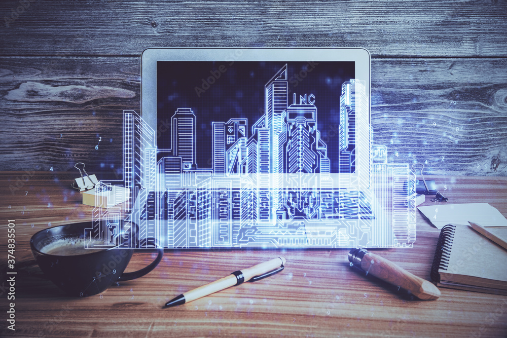 Desktop computer background in office and big town buildings hologram ...