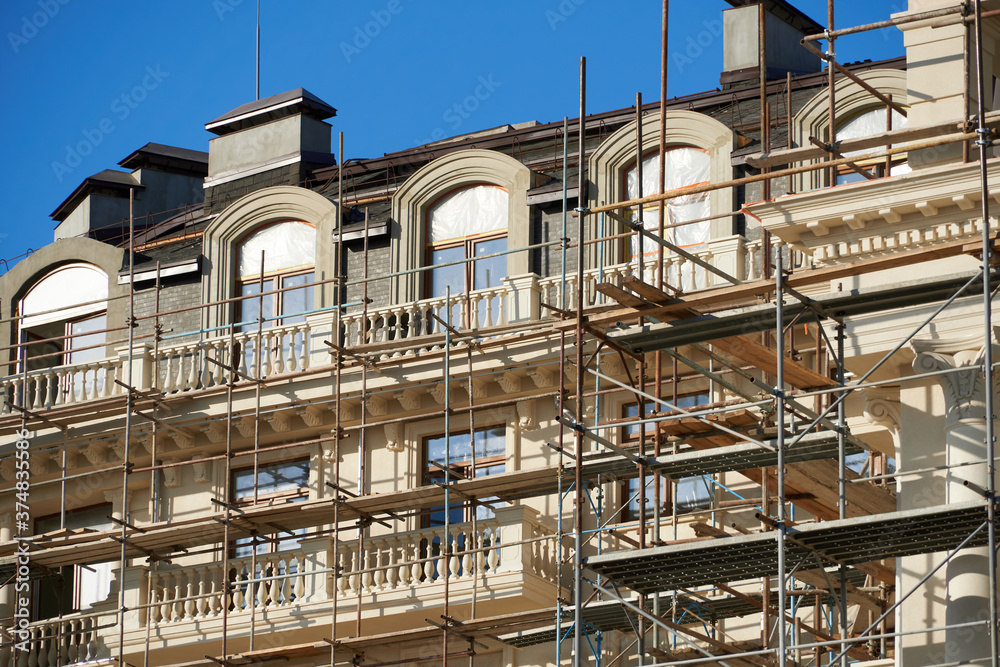 scaffolding and new building as background scaffolding and new building as background
