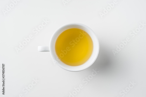 Top view of cup of hot tea on white background
