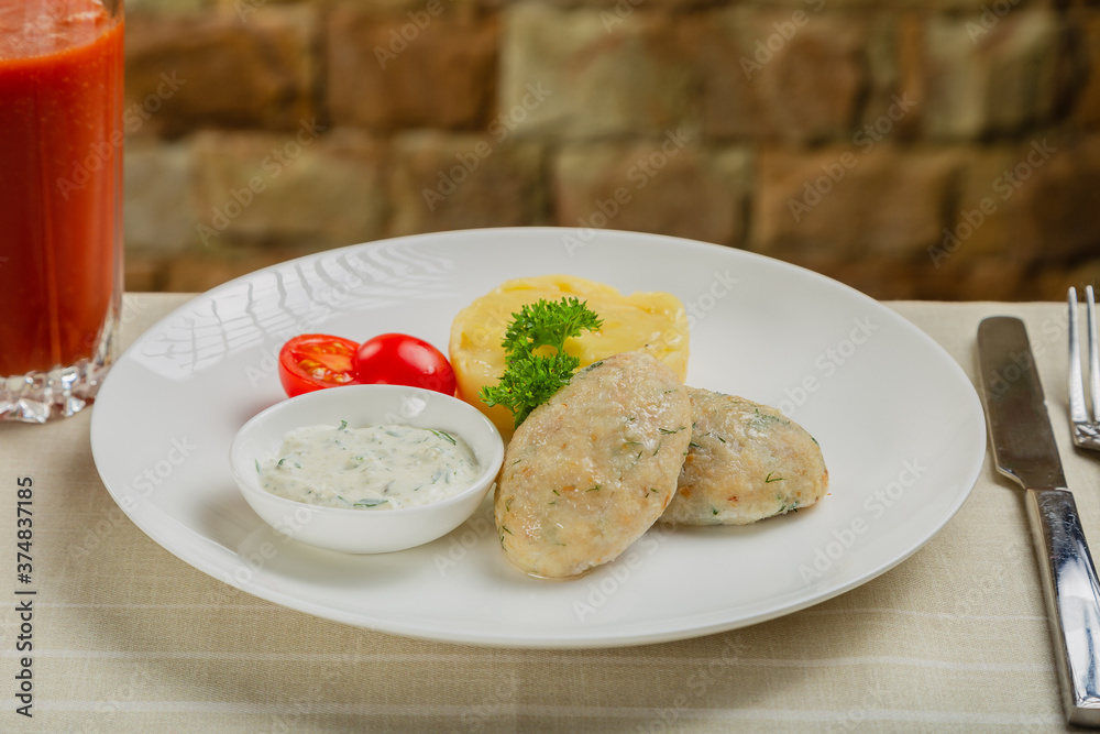 Hot cutlets with mashed potatoes and sauce. Hot cutlets with mashed potatoes and sauce.