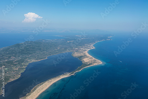 Aerial view of the Corfu island surrounded by turquoise water of the Adriatic sea. Greece 2020.