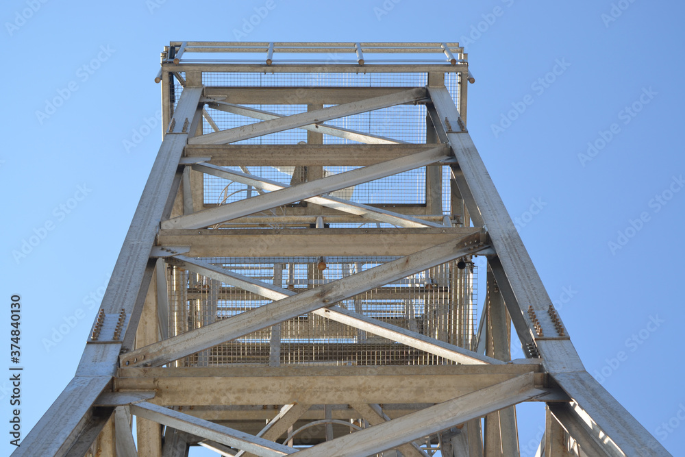 tower formed by metal profiles with a platform at the top
tower formed by metal profiles with a platform at the top