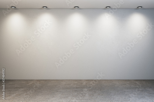 Glowing backdrop with spotlight and blank wall.