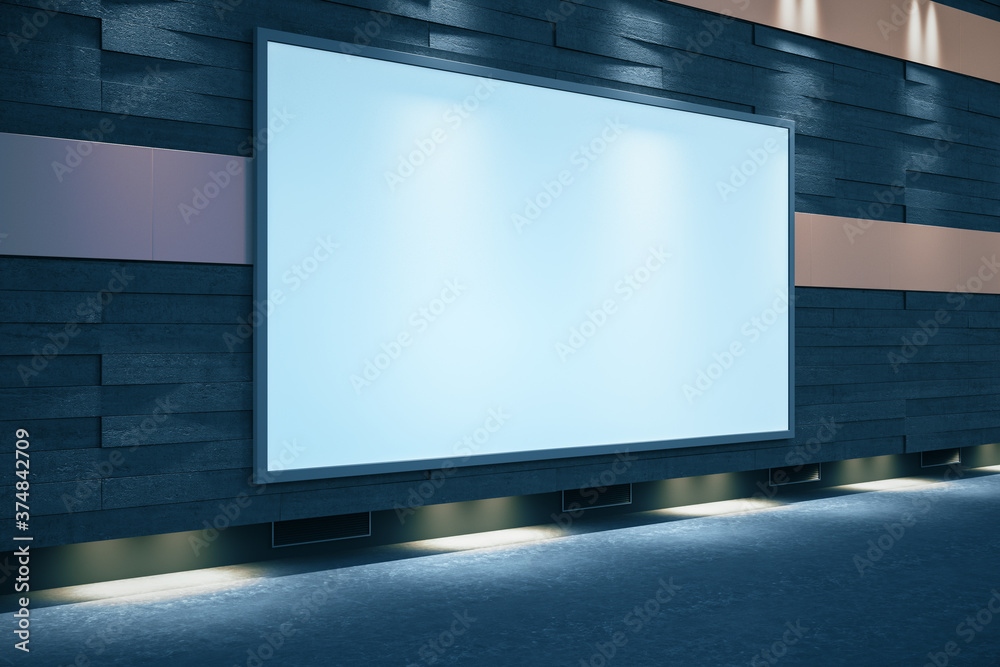 Blank glowing billboard on street at night.