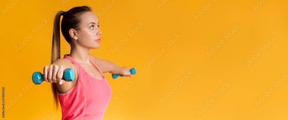 Young Sporty Woman Training With Dumbbells Over Yellow Background Young Sporty Woman Training With Dumbbells Over Yellow Background
