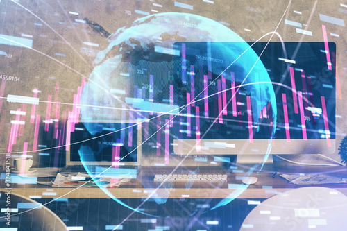 Multi exposure of graph and financial info and work space with computer background. Concept of international online trading.