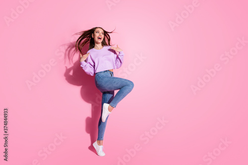 Full length photo of candid excited youth girl enjoy rejoice look good copyspace wear lilac pullover hair cut fly wind isolated over pastel color background