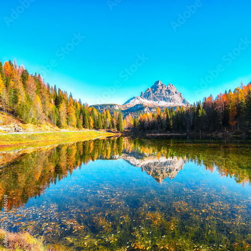 Stunning view of popular travel destination mountain lake Antorno in autumn