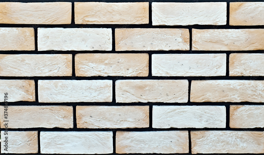 Texture of brick wall. new brickwork. Samples of wall or fence are presented at exhibitions. Yellow brick close up. Texture of brick wall. new brickwork. Samples of wall or fence are presented at exhibitions. Yellow brick close up.