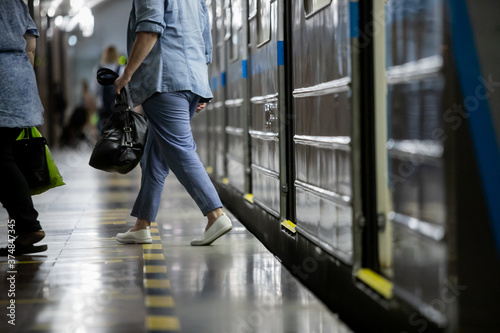 People get off the train car in the subway