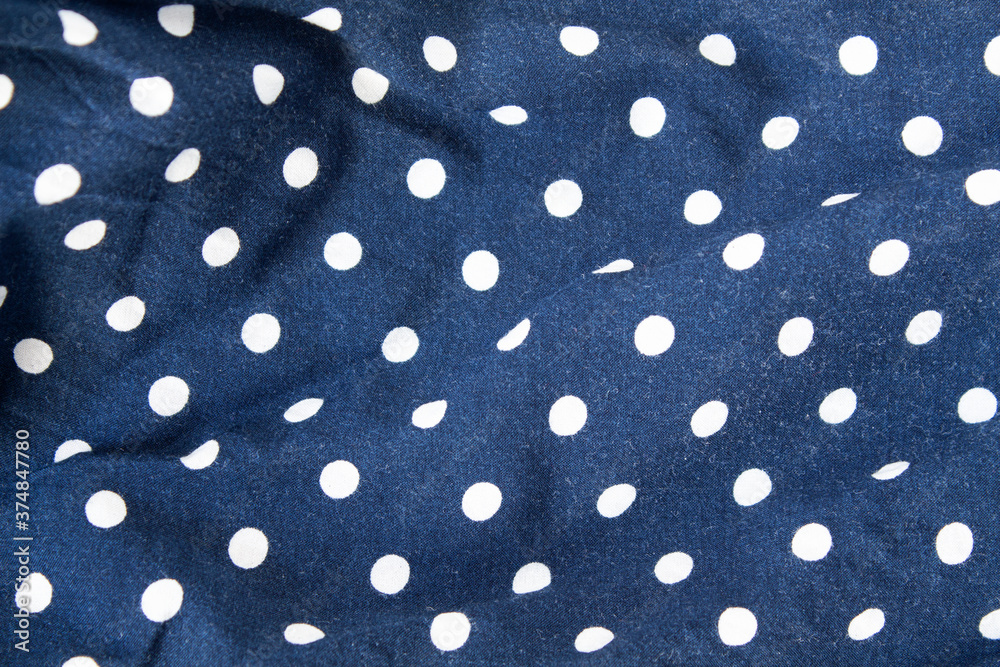 Crumpled blue polka dot fabric. Texture Crumpled blue polka dot fabric. Texture