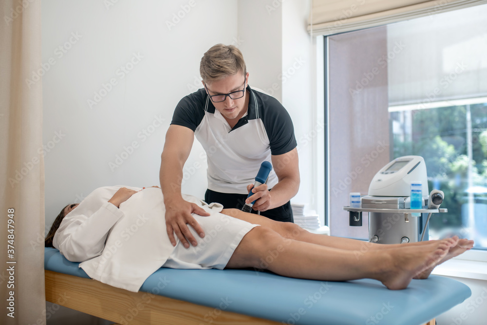 Obraz premium Doctor doing an ultrasound diagnostics to a woman