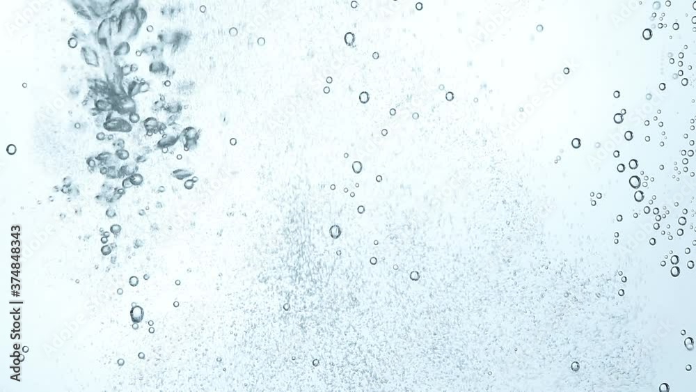 Close up pouring sparkling water in glass