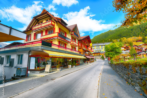 Fantastic autumn view of traditional swiss chalets in Wengen village