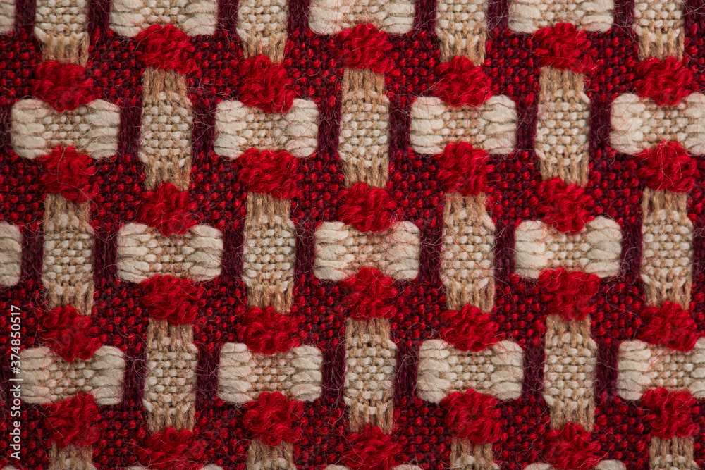 multi-colored fabric made of beige, red and white threads, texture, background