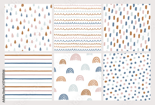 Set of hand drawn vector patterns in trendy colors. Doodles made with ink. Rainbow, stripes, dots, rain drops, brush strokes. Seamless geometric backgrounds. 