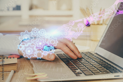 A man working on Laptop with technology theme drawing. Concept of big data. Double exposure.