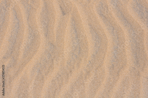 Find sand texture with wind lines as a background or wallpaper