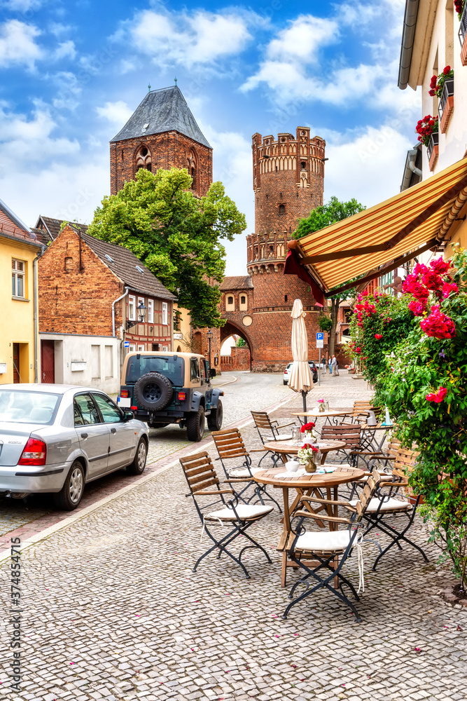 Neustädter Tor in the old town of Tangermünde with chairs and table in foreground