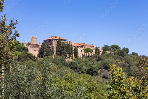 Italian ancient city on the hill. Populonia village in Tuscany Medieval architecture sourranding by italian nature. Summertime.