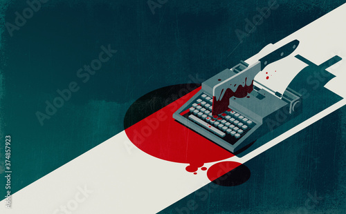 Horror movie concept: vintage typewriter and cleaver with blood