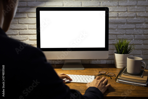 businessman working empty screen computer mockup on wood desk in office.