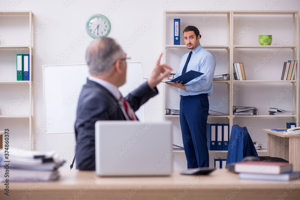 Two employees in the office Two employees in the office