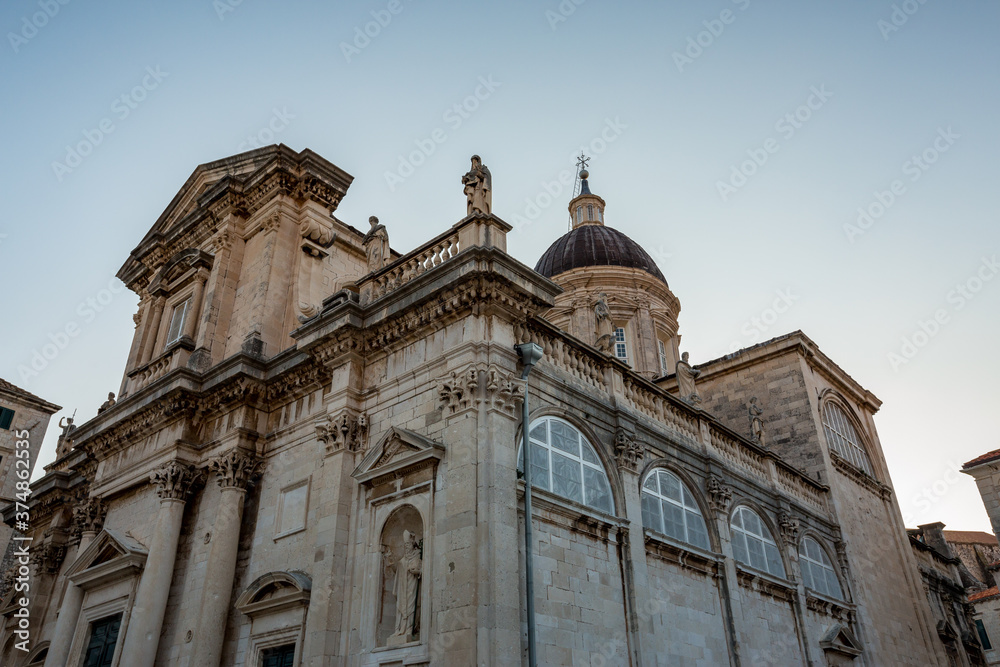 Low angle view, amazing church architecture, cold light and feel. Scenery winter view of Mediterranean old city of Dubrovnik, famous European travel and historic destination, Croatia